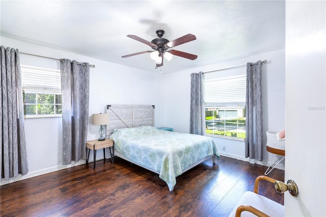 2423 NW 67th Ter, Gainesville, FL 32606 - bedroom with baseboards, wood finished floors, and ceiling fan