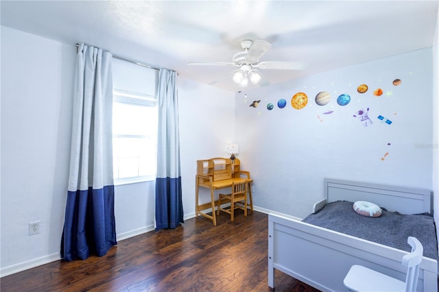 2423 NW 67th Ter, Gainesville, FL 32606 - bedroom with baseboards, a ceiling fan, and wood finished floors