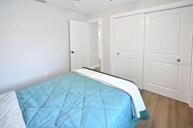 418 40th Ave S, Saint Petersburg, FL 33705 - bedroom featuring wood finished floors and a closet
