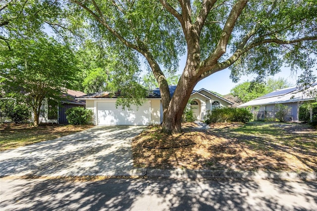 6114 NW 35th St, Gainesville, FL 32653 - view of front of property with stucco siding, concrete driveway, and a garage