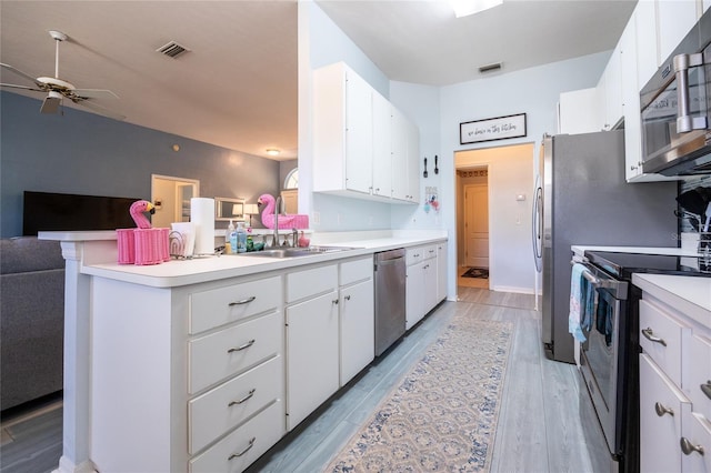 6114 NW 35th St, Gainesville, FL 32653 - kitchen with a sink, stainless steel appliances, ceiling fan, visible vents, and open floor plan