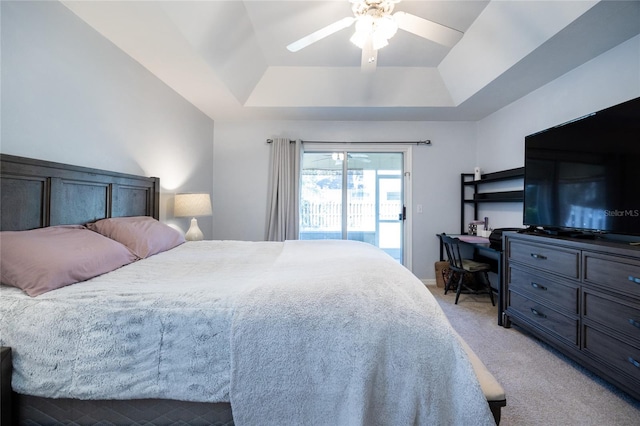 6114 NW 35th St, Gainesville, FL 32653 - bedroom featuring a ceiling fan, access to outside, light carpet, and a tray ceiling