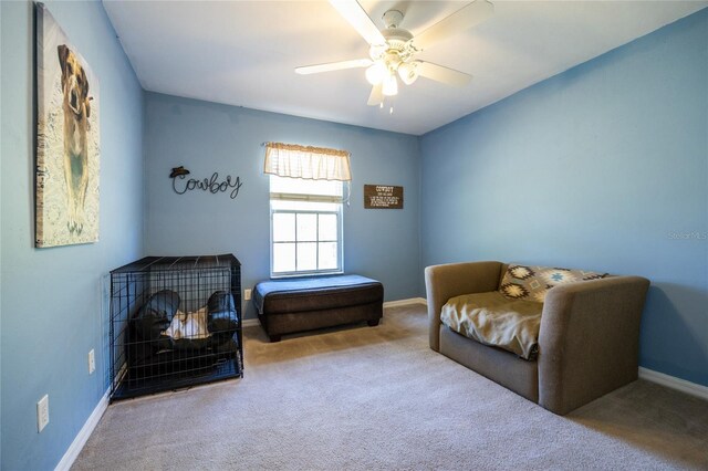6114 NW 35th St, Gainesville, FL 32653 - sitting room with baseboards, a ceiling fan, and carpet flooring
