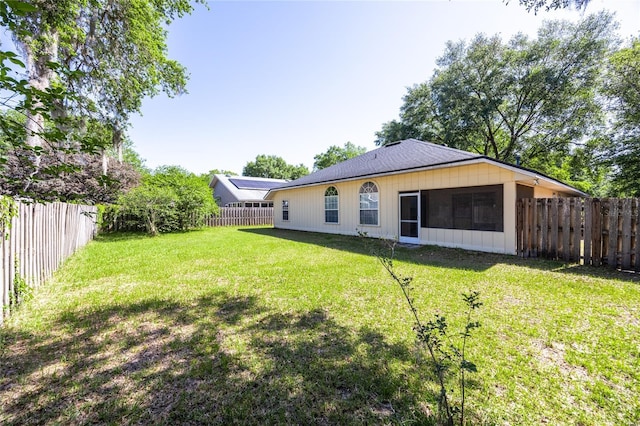 6114 NW 35th St, Gainesville, FL 32653 - back of property with a fenced backyard and a yard