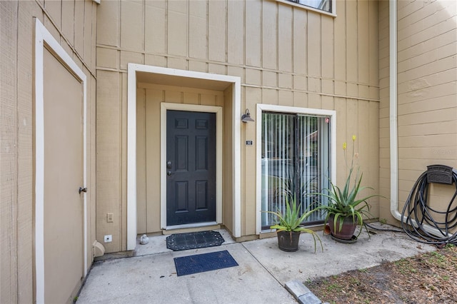 507 NW 39th Rd Unit 317, Gainesville, FL 32607 - view of exterior entry with board and batten siding