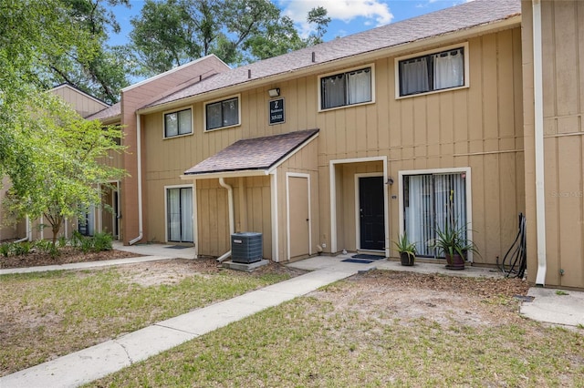 507 NW 39th Rd Unit 317, Gainesville, FL 32607 - multi unit property with roof with shingles, central air condition unit, and a front yard