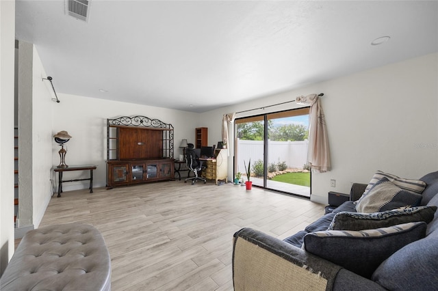 507 NW 39th Rd Unit 317, Gainesville, FL 32607 - living area featuring light wood-style flooring and baseboards