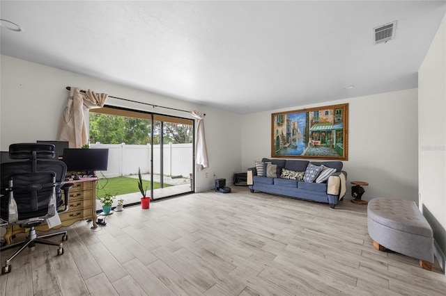 507 NW 39th Rd Unit 317, Gainesville, FL 32607 - living room with an office area and wood finished floors