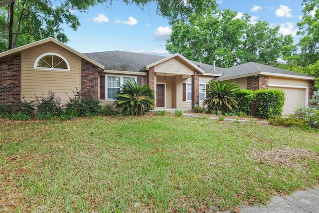 8145 SW 51st Rd, Gainesville, FL 32608 - ranch-style house with brick siding, a garage, and a front lawn