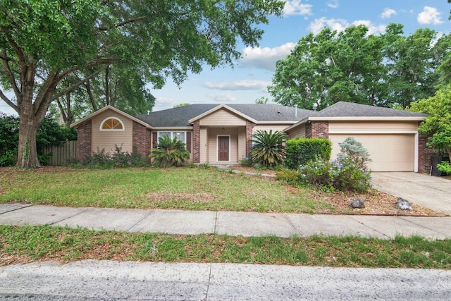 8145 SW 51st Rd, Gainesville, FL 32608 - single story home with brick siding, an attached garage, and driveway