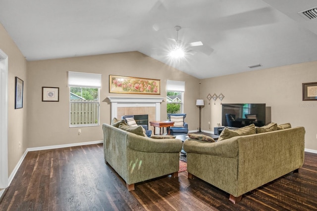 8145 SW 51st Rd, Gainesville, FL 32608 - living room featuring a ceiling fan, healthy amount of natural light, dark wood-style floors, a tile fireplace, and vaulted ceiling