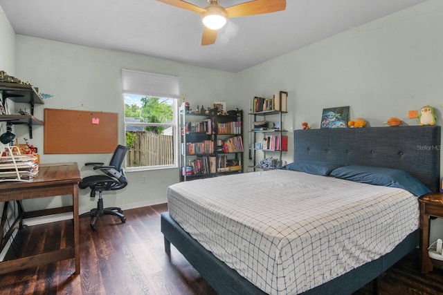 8145 SW 51st Rd, Gainesville, FL 32608 - bedroom featuring wood finished floors, a desk, baseboards, and a ceiling fan