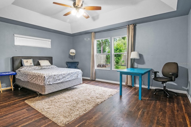 8145 SW 51st Rd, Gainesville, FL 32608 - bedroom with a tray ceiling, baseboards, wood finished floors, and ceiling fan