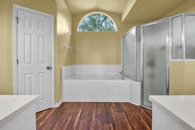 8145 SW 51st Rd, Gainesville, FL 32608 - full bath with vanity, vaulted ceiling, wood finished floors, a bath, and a shower stall
