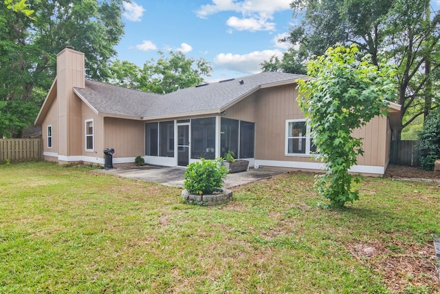 8145 SW 51st Rd, Gainesville, FL 32608 - rear view of property with a sunroom, a patio area, a chimney, and a shingled roof