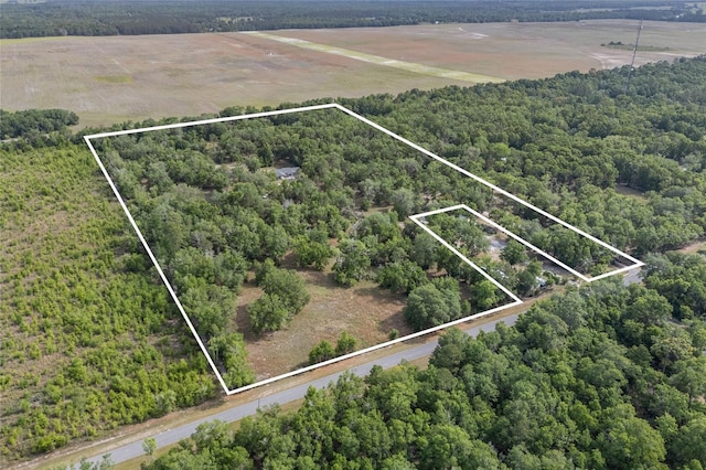 bird's eye view featuring a rural view and a view of trees