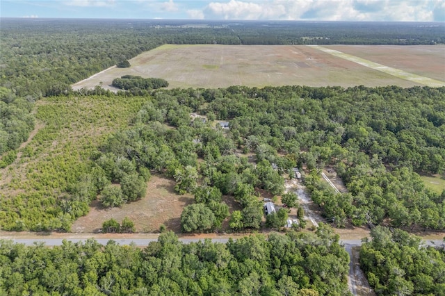 drone / aerial view featuring a forest view