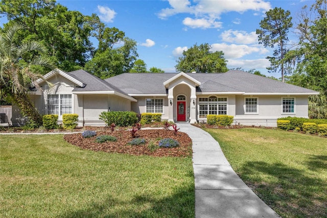 single story home with a front yard and stucco siding