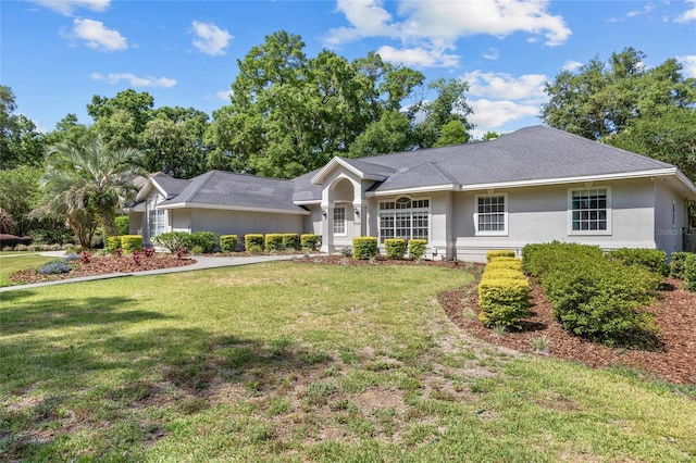 single story home featuring stucco siding and a front yard