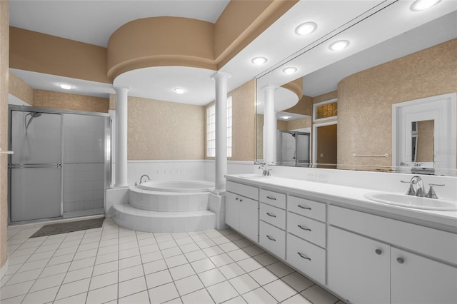 full bath with ornate columns, a shower stall, tile patterned floors, and a garden tub