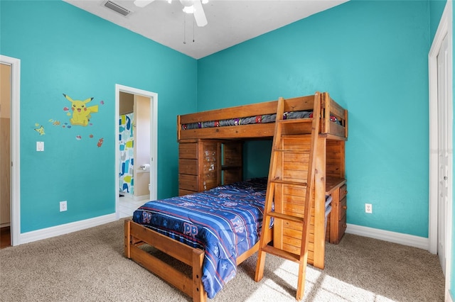 carpeted bedroom with baseboards, a ceiling fan, and connected bathroom