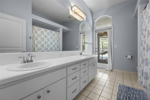 full bathroom featuring double vanity and tile patterned flooring