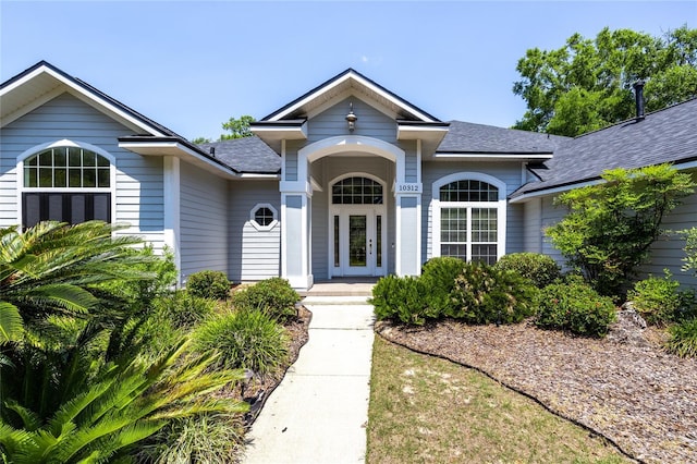10312 SW 23rd Ave, Gainesville, FL 32607 - view of front of home with a shingled roof and covered porch