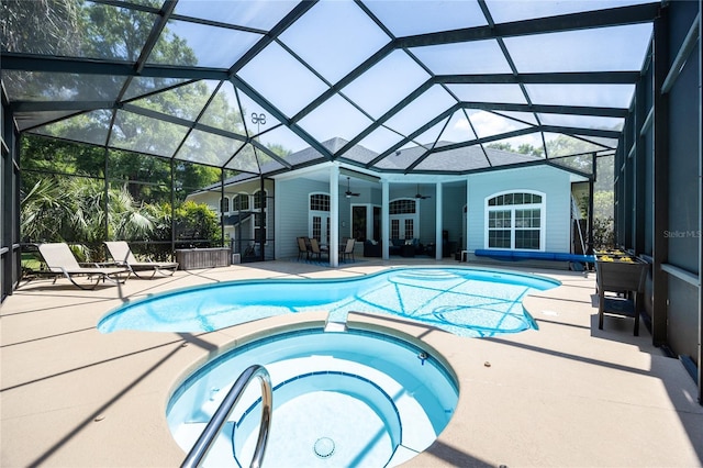 10312 SW 23rd Ave, Gainesville, FL 32607 - view of swimming pool with a ceiling fan, a pool with connected hot tub, a patio area, and a lanai