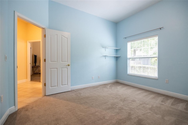 10312 SW 23rd Ave, Gainesville, FL 32607 - carpeted spare room featuring baseboards and tile patterned flooring