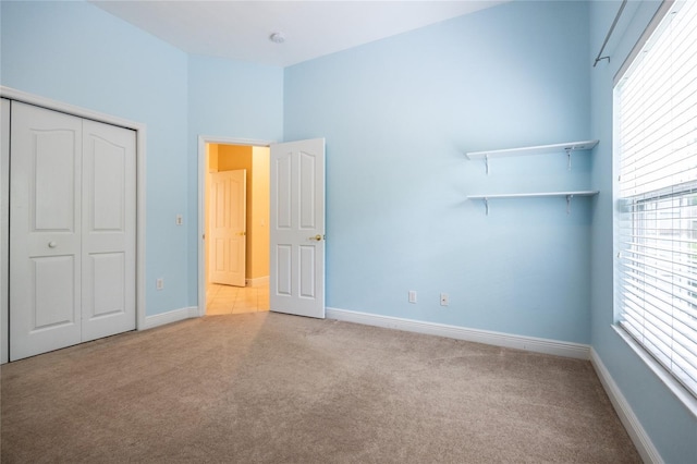 10312 SW 23rd Ave, Gainesville, FL 32607 - unfurnished bedroom featuring carpet, baseboards, and multiple windows