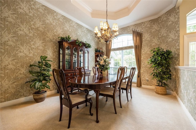 10312 SW 23rd Ave, Gainesville, FL 32607 - dining area featuring healthy amount of natural light, a tray ceiling, carpet, wallpapered walls, and a chandelier