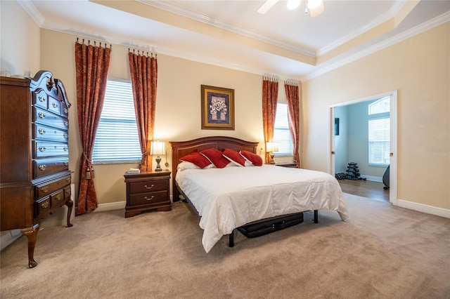10312 SW 23rd Ave, Gainesville, FL 32607 - bedroom with ornamental molding, light carpet, baseboards, a raised ceiling, and ceiling fan