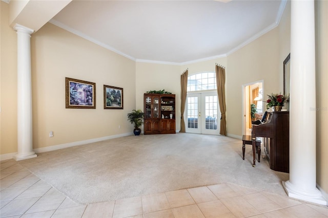 10312 SW 23rd Ave, Gainesville, FL 32607 - living room featuring ornate columns, light carpet, ornamental molding, french doors, and baseboards