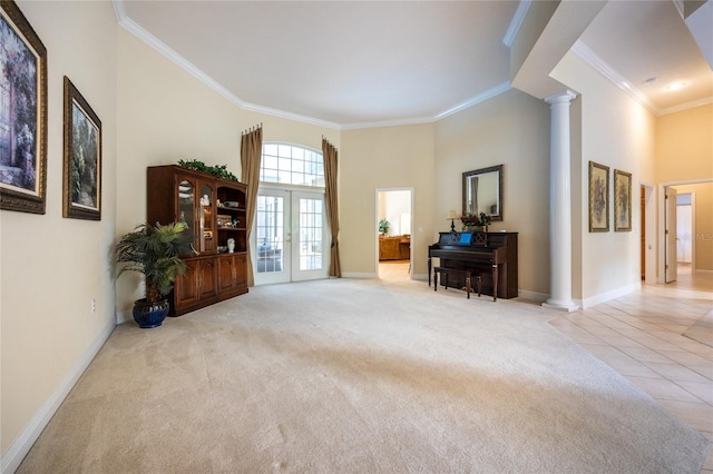 10312 SW 23rd Ave, Gainesville, FL 32607 - living area featuring ornate columns, a towering ceiling, ornamental molding, baseboards, and carpet floors