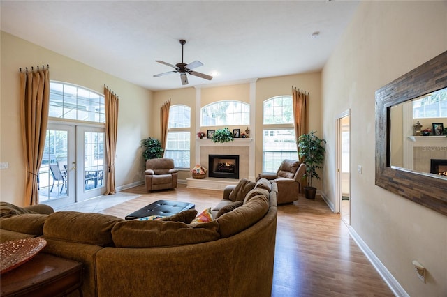 10312 SW 23rd Ave, Gainesville, FL 32607 - living area with a tile fireplace, plenty of natural light, and baseboards
