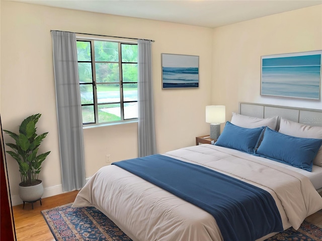 1041 NE 10th Ave, Gainesville, FL 32601 - bedroom with wood finished floors and baseboards