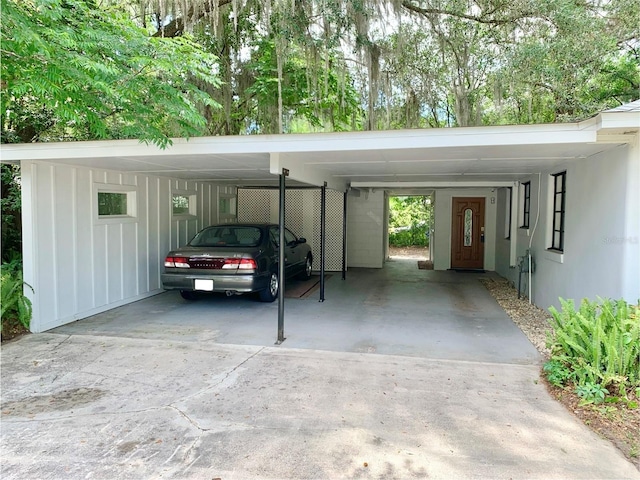 1041 NE 10th Ave, Gainesville, FL 32601 - view of car parking featuring a carport and driveway