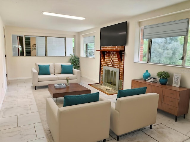 1041 NE 10th Ave, Gainesville, FL 32601 - living area featuring light marble finish floors, a fireplace, and baseboards
