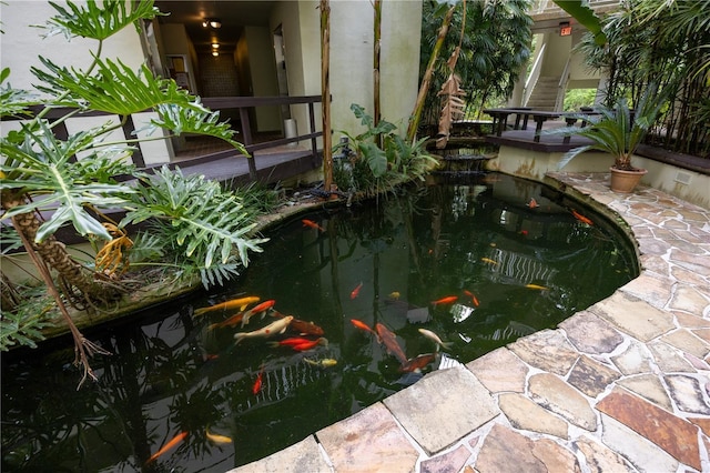 exterior space with a small pond