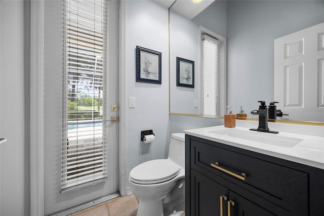 4606 SW 97th Ter, Gainesville, FL 32608 - half bath featuring vanity, toilet, and tile patterned flooring