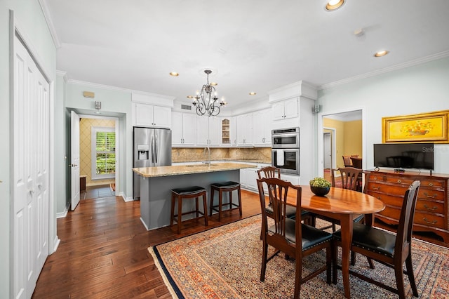 4319 SW 86th Way, Gainesville, FL 32608 - dining room with a chandelier, ornamental molding, recessed lighting, and dark wood finished floors