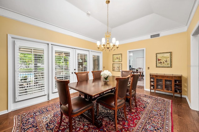 4319 SW 86th Way, Gainesville, FL 32608 - dining room featuring a chandelier, wood finished floors, and a raised ceiling