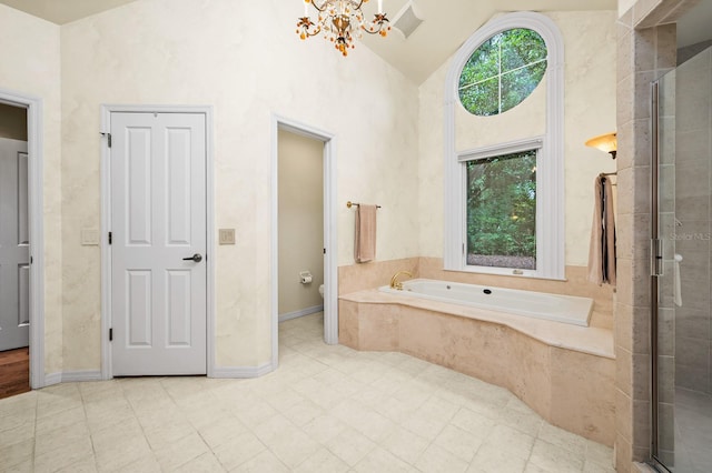 4319 SW 86th Way, Gainesville, FL 32608 - bathroom with a garden tub, a chandelier, a stall shower, high vaulted ceiling, and tile patterned flooring