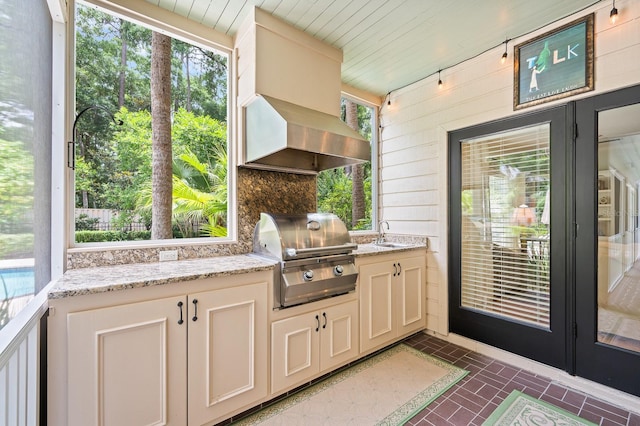 4319 SW 86th Way, Gainesville, FL 32608 - view of patio / terrace featuring an outdoor kitchen and french doors