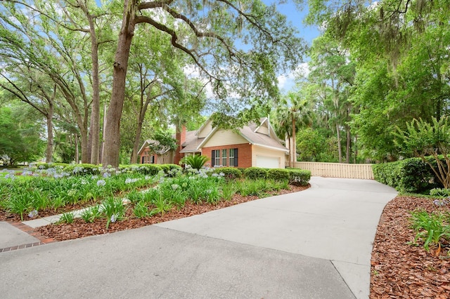 4319 SW 86th Way, Gainesville, FL 32608 - view of side of property featuring driveway and brick siding