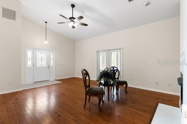 23225 NW County Rd 236, High Springs, FL 32643 - dining room with plenty of natural light, ceiling fan, wood finished floors, and visible vents