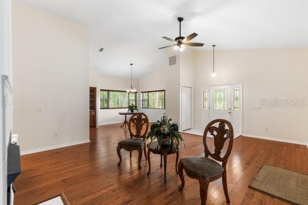23225 NW County Rd 236, High Springs, FL 32643 - interior space featuring visible vents, wood finished floors, baseboards, high vaulted ceiling, and ceiling fan with notable chandelier