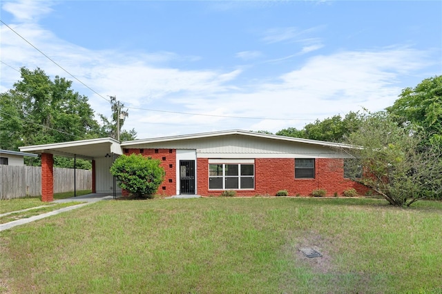 529 NE 12th Ct, Gainesville, FL 32601 - ranch-style house featuring a carport and brick siding