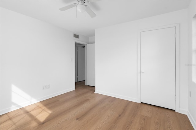 529 NE 12th Ct, Gainesville, FL 32601 - unfurnished bedroom featuring wood finished floors, baseboards, and ceiling fan
