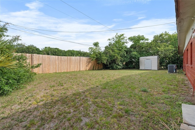 529 NE 12th Ct, Gainesville, FL 32601 - view of yard with a storage unit, an outbuilding, and central AC